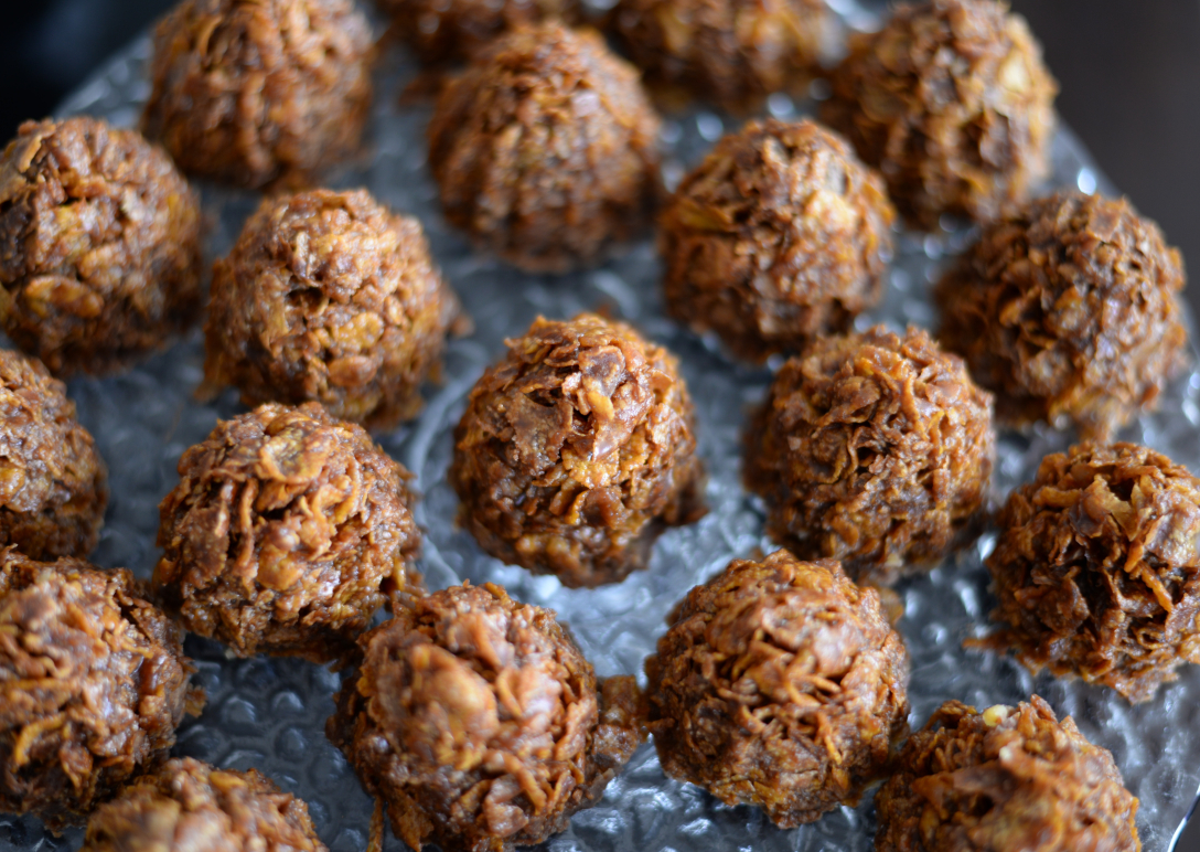 A set of energy ball snacks laid out on a tray. 