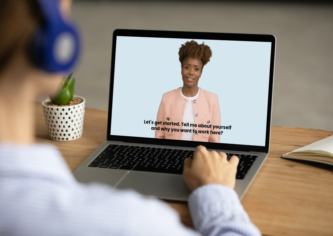 A computer screen with a friendly job interviewer who is ready to ask questions.