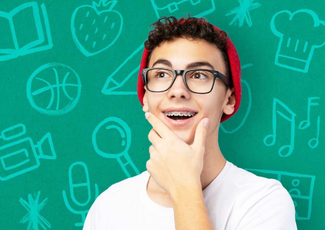 Youth in dark rimmed glasses and red hat eager to complete a career quiz.