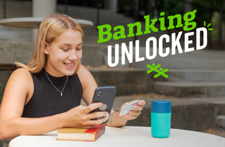 A female teen checks her bank account online on her phone.