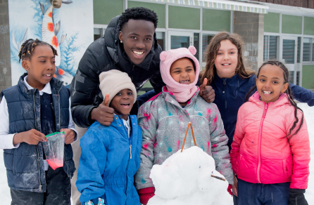 A group of happy youth with a youth leader.