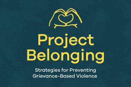 A yellow icon of two hands forming a heart above the text “Project Belonging – Strategies for Preventing Grievance-based Violence” on a navy background